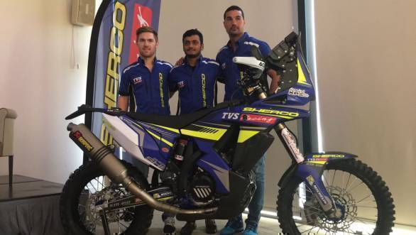 Adrian Metge, KP Aravind and Juan Pedrero pose with the TVS Sherco 450 Rally that they will each pilot at the 2017 Dakar Rally