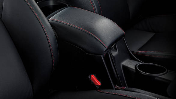 The 2017 Toyota Innova Crysta Touring Sport features red stitching on the seat as well as on the console box