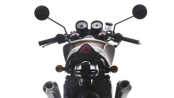 The SWM Gran Milano rear cowl is well made and we saw painted as well a leather-finished example. The little triangular light inset into the cowl is a good little detail