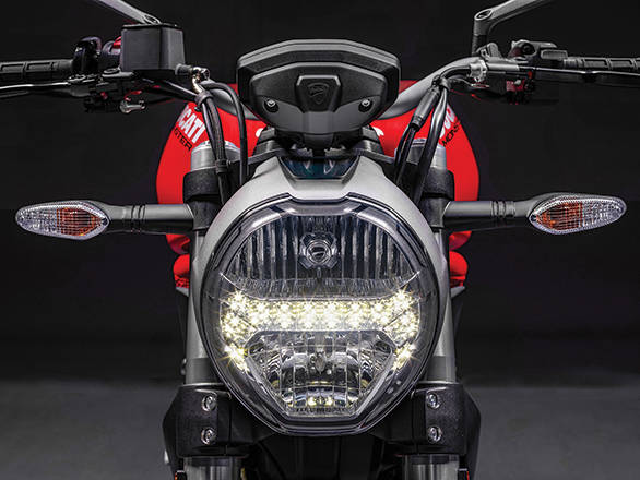 The rounded headlamp takes cues from the Ducati Monster design book. Looks great with the LED strip bisecting it into half