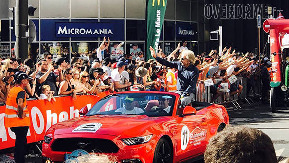 Derek Bell gets a rousing cheer from the fans during the Driver's Parade