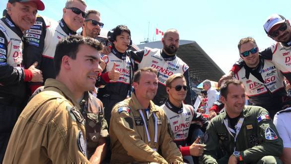 French air crew stopped by to pose with the Toyota crew. Men in uniform of different kinds at Le Mans