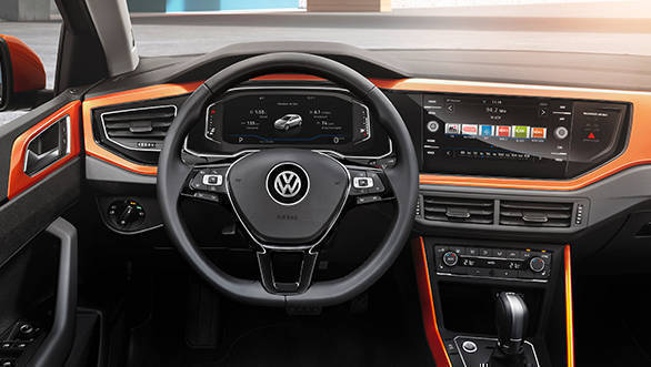 The steering wheel is a flat bottomed unit and houses the single button to access the meter console functions