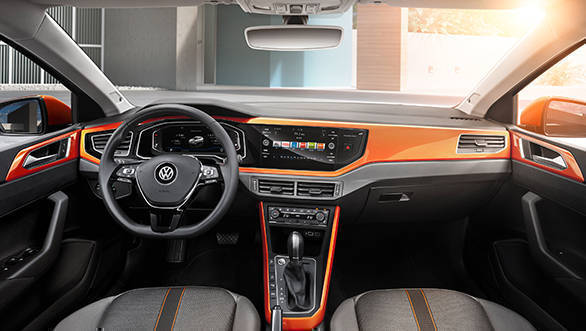 This is the R-Line trim and has orange accents to complement the exterior colour. The minimal button approach from the older car is continued here too