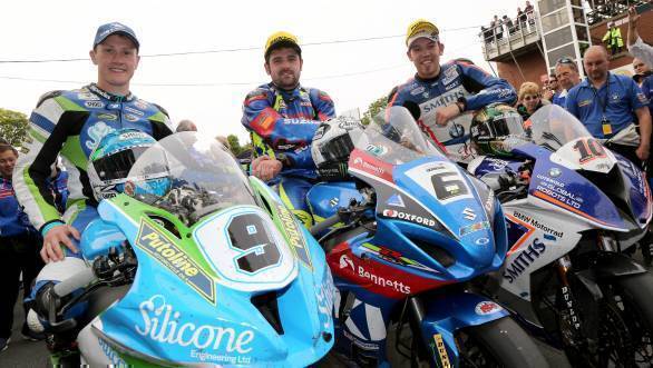 Michael Dunlop (Bennett's Suzuki) celebrates winning the Senior TT with runner up Peter Hickman (Smith's BMW) and third placed Dean Harrison (Silicone Kawasaki). (PICTURE BY STEPHEN DAVISON)