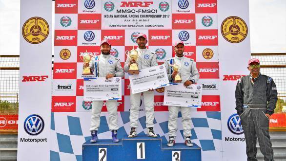 Sandeep Kumar on the top step of the podium for Race 2 of the Ameo Cup, flanked by second-placed Karminder Singh and third-placed Dhruv Mohite