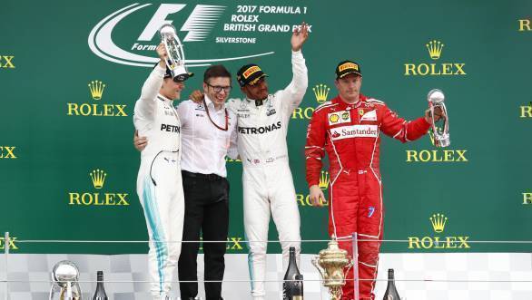 The Mercedes trio certainly are jubilant, while Kimi Raikkonen looks appropriately sullen after having to settle for third place