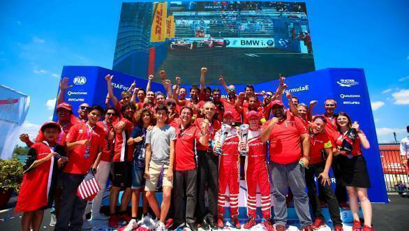 The Mahindra Racing team celebrates their double podium finish at the second race of the NYC ePrix