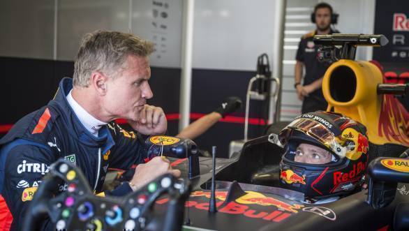WRC driver Sebastien Ogier consults with David Coulthard in Spielberg, Austria during his F1 outing with the Red Bull Racing team