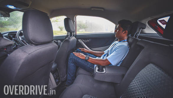 The sloping roofline doesn't eat space at the back. In fact, the packaging is very clever and Tata has used thin foam for the seats to liberate more space inside the cabin. Here is 5ft 7inch tall Anis sitting behind the driver's seat set for a 6ft plus driver