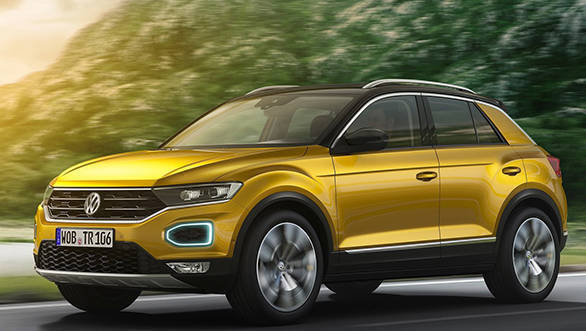 The front of the Volkswagen T-Roc is dominated by a wide grill that converges into the slim LED headlamps