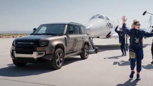 Land Rover Defender tows Virgin Galactic's first-ever fully-crewed space flight aircraft